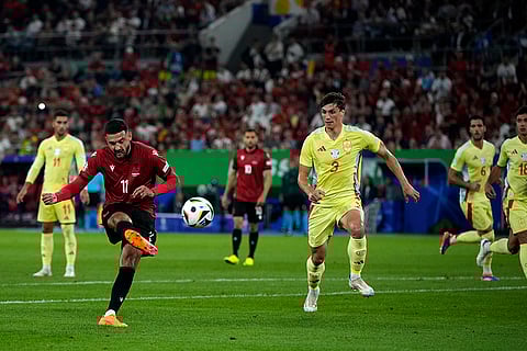Albania's Armando Broja shoots the ball against Spain